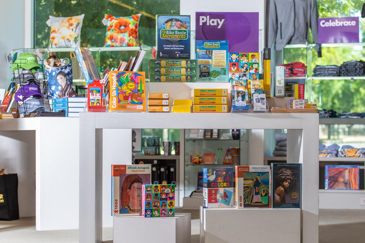 A table of various games, puzzles, and art-related activities in the Museum store.